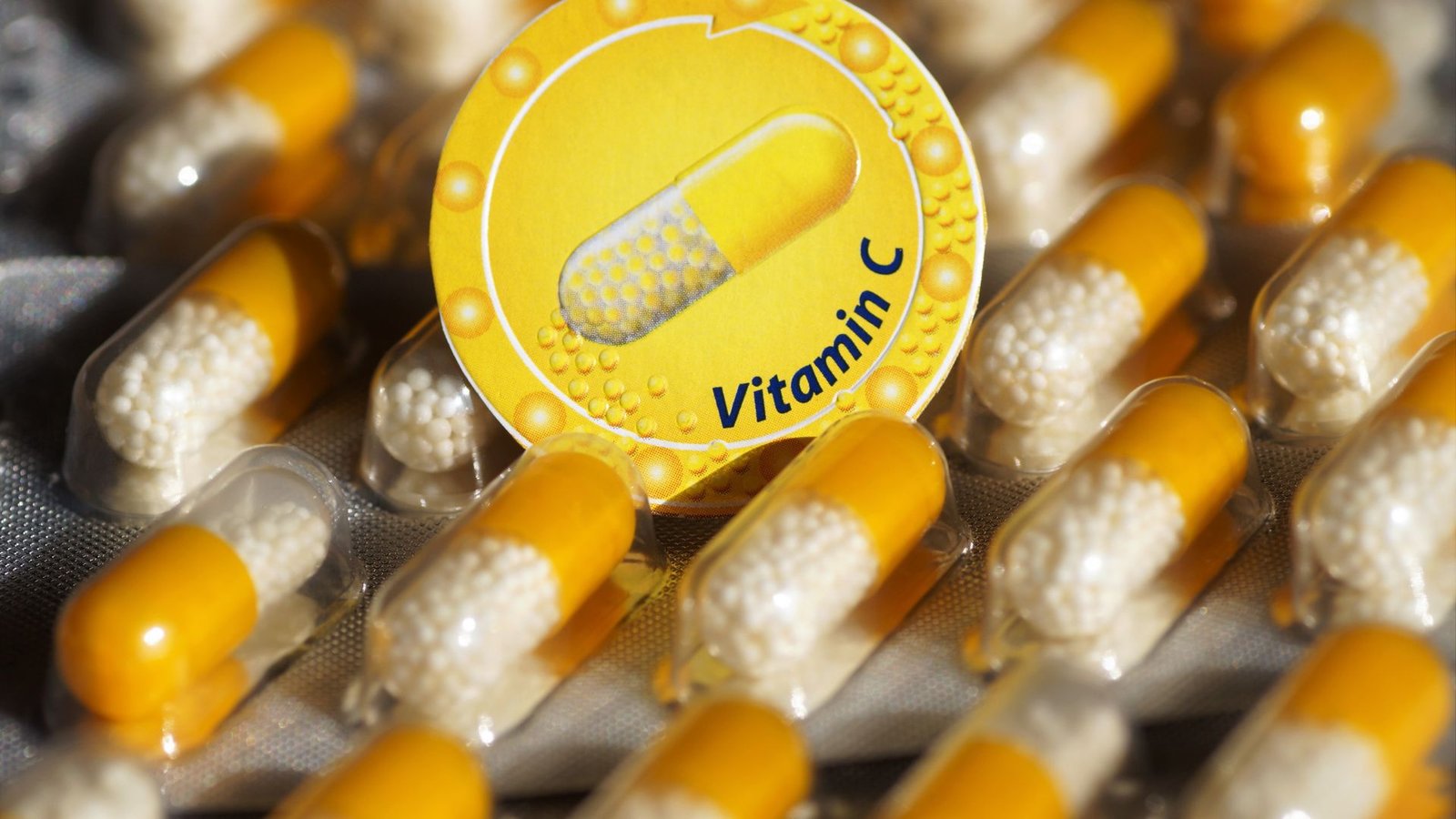 morning routine with water and vitamin C capsules