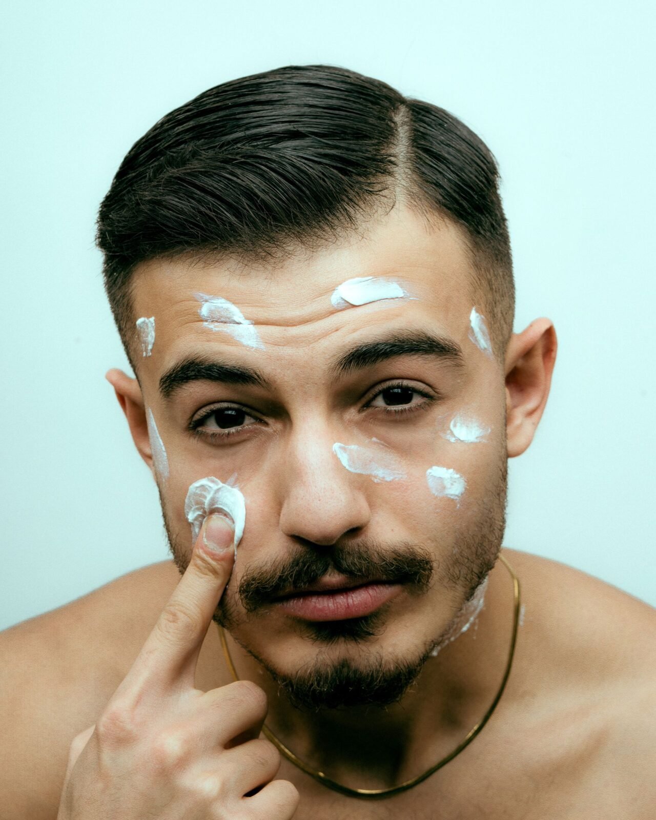 applying daily face moisturizer