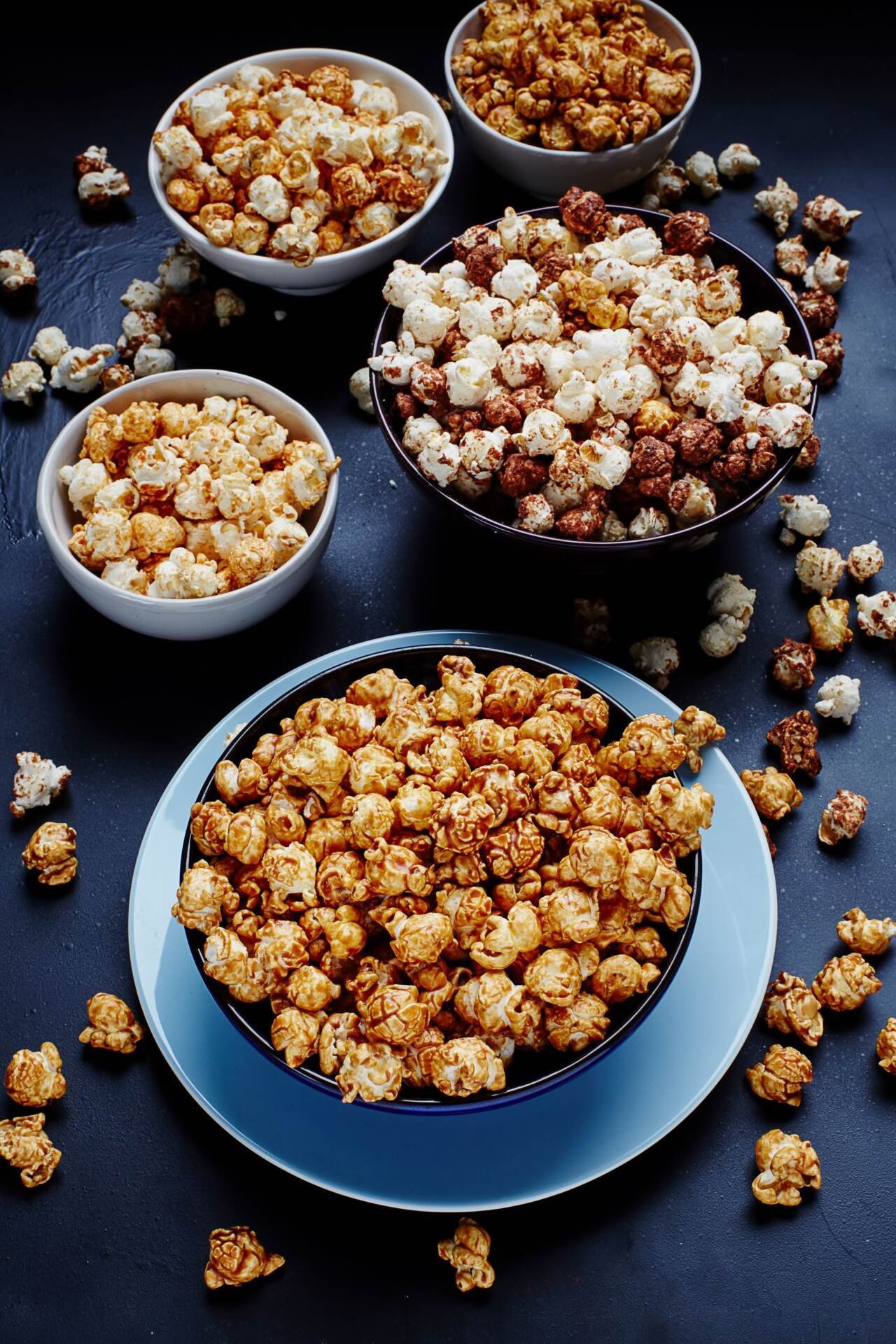 bowls of seasoned popcorn viewed from above