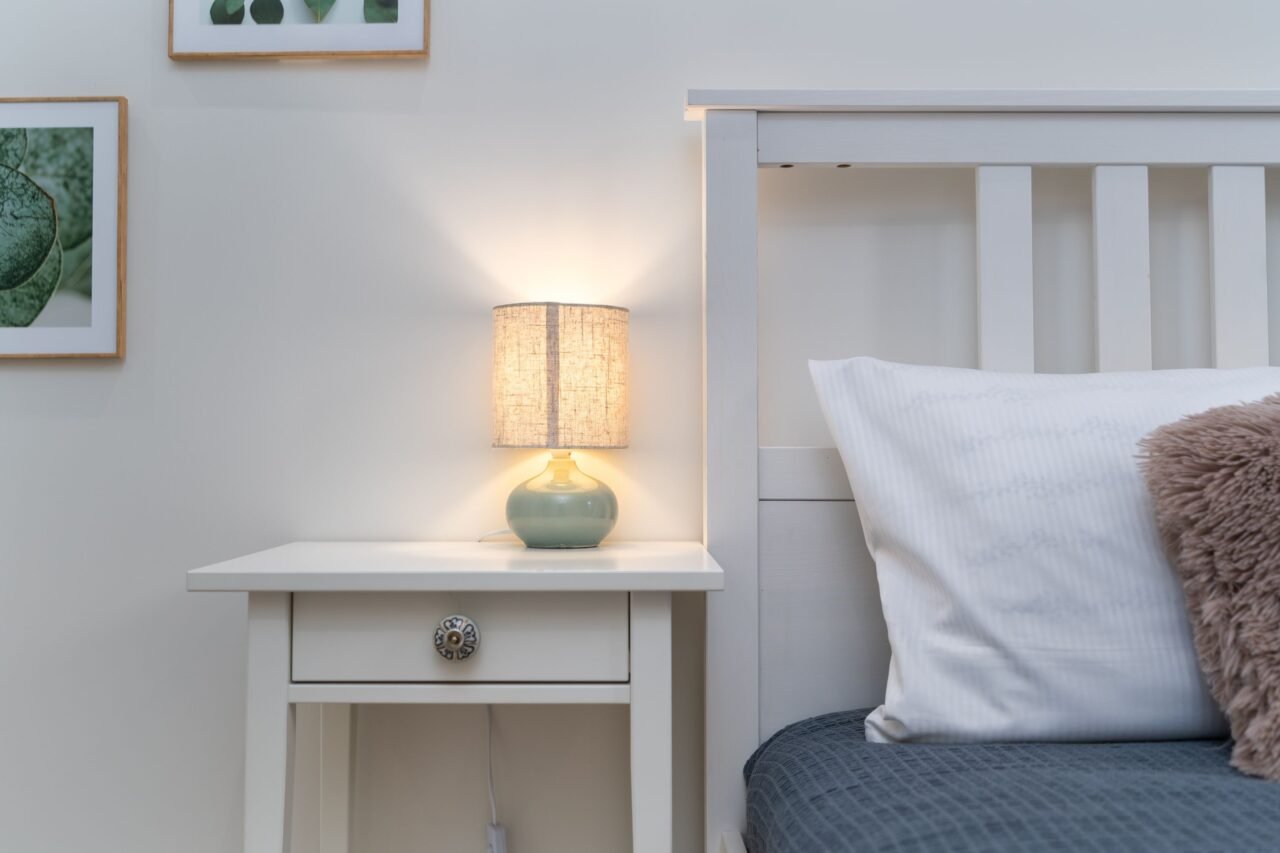 supplement bottle on a nightstand in a bedroom