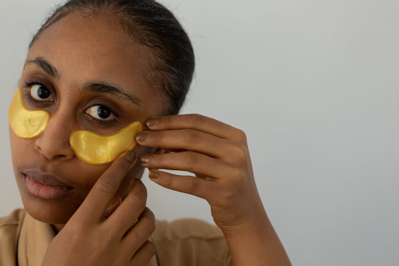 applying a patch as part of an evening skincare routine
