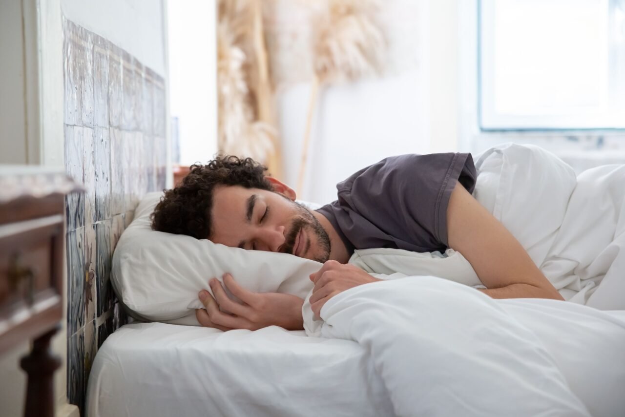 person relaxing in bed