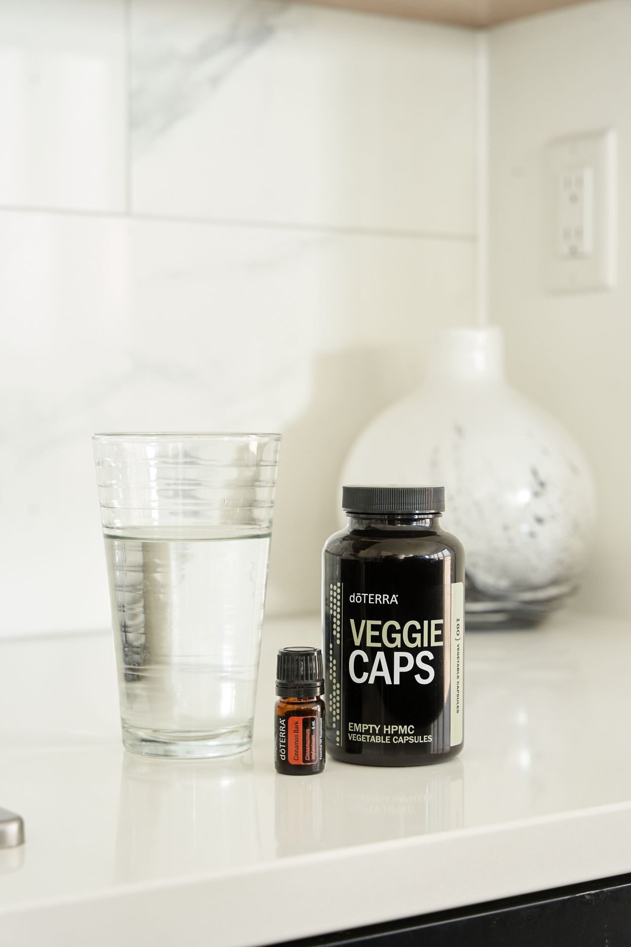 morning routine with water and vitamin C capsules