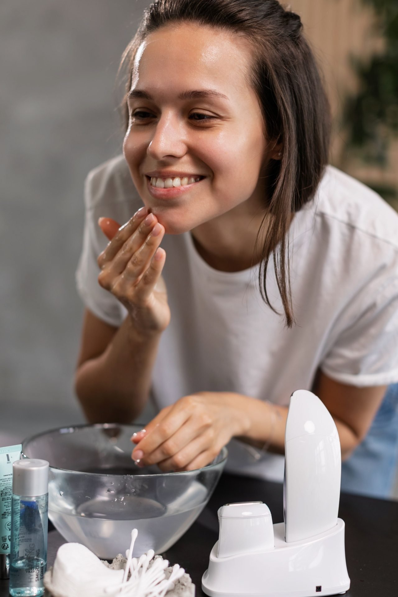 applying toner to the face with hands