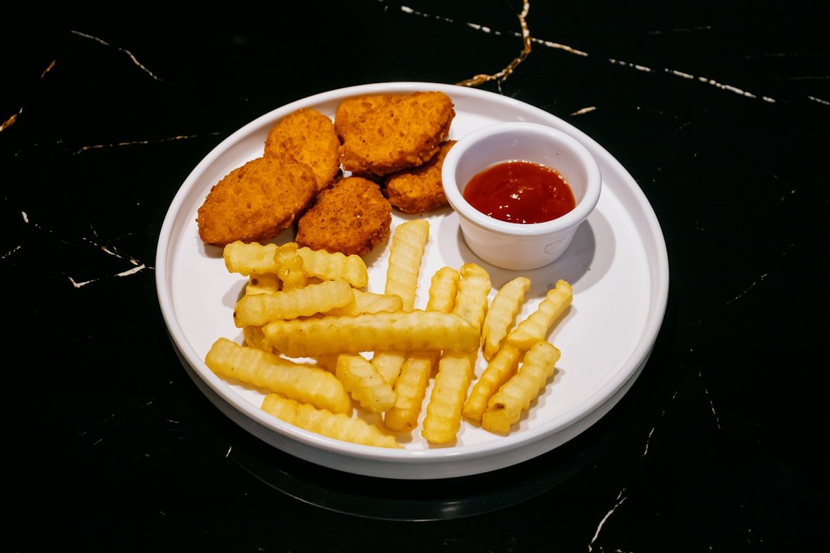 fast food combo meal with nuggets, fries, and a drink