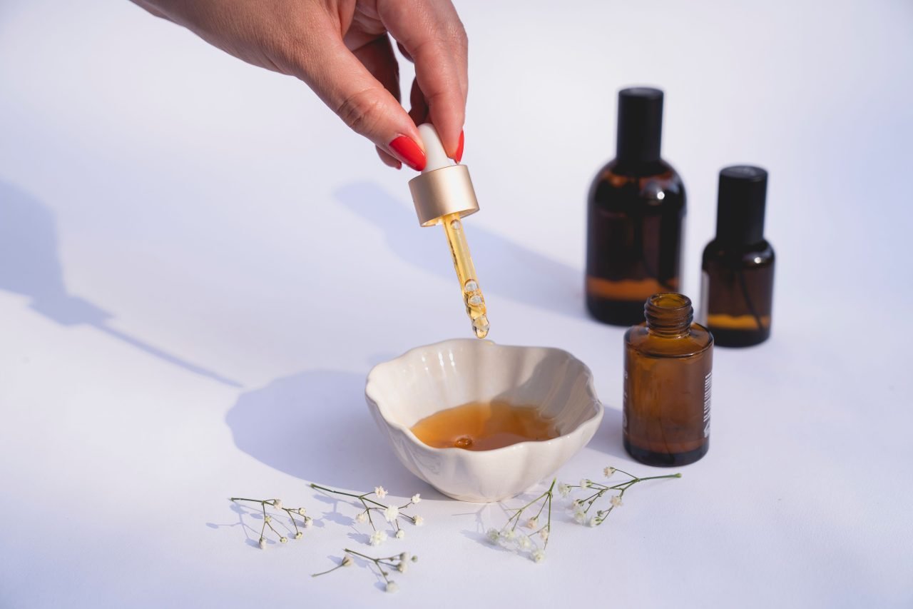 close-up of snail mucin essence dropper bottle and texture