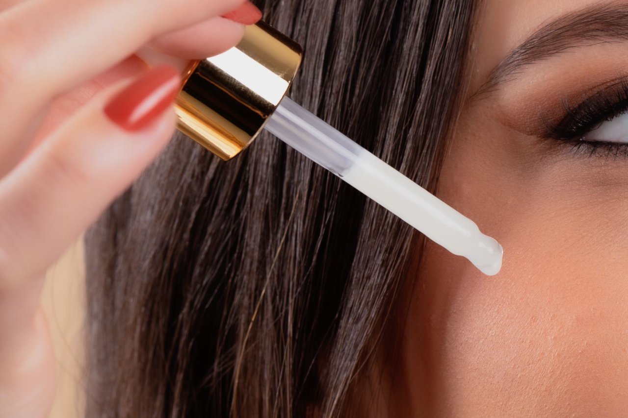 applying spicule serum to skin