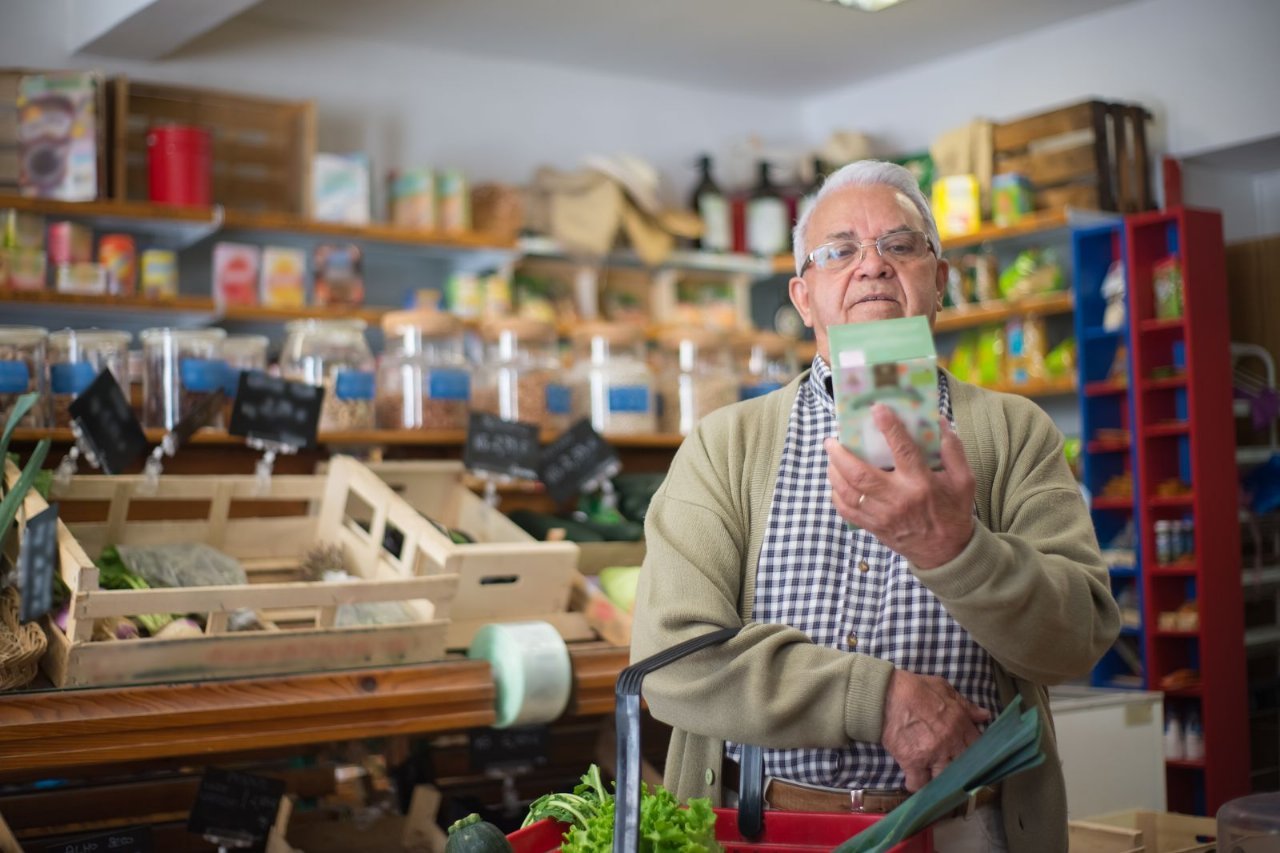 shopper checking a product label for recall codes